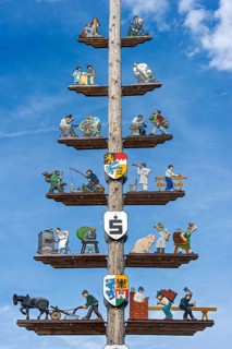 Maypole with carved guild sign