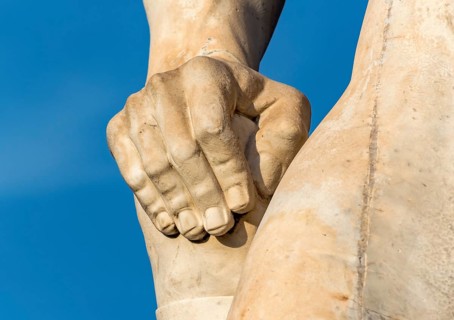 Close-up of hand of athlete statue at Stadio dei Marmi