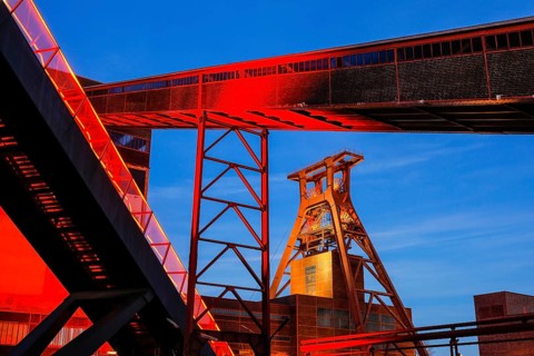 UNESCO World Heritage Zeche Zollverein illuminated red in the evening