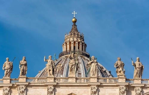 Dome of St. Peter's Basilica with statues of Saints Thomas
