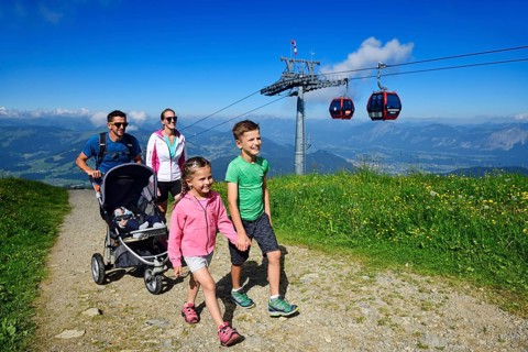 Family hiking on the summit panorama trail of the Hohe Salve