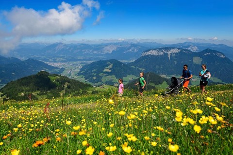 Family hiking on the summit panorama trail of the Hohe Salve