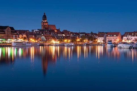 City harbour with church St. Marien at dusk
