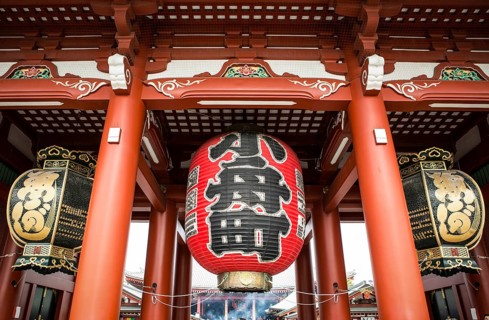 Large red Chochin lantern and two copper lanterns