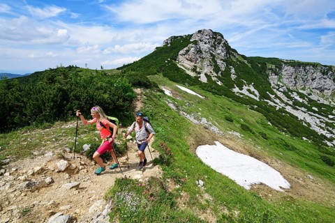Hikers climbing to the summit of the Geigelstein