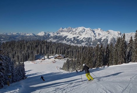 Ski area Planai with fairytale meadow hut and view to the Dachstein massif