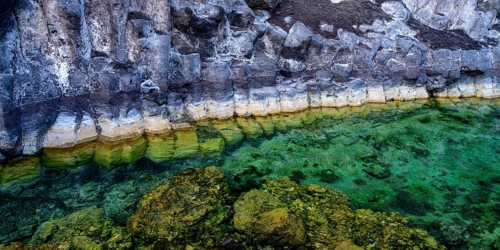 Formation of basalt stones on a steep coast at the Atlantic Ocean