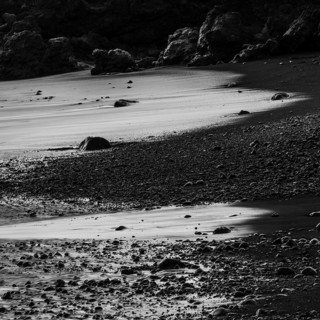 Water washes around stones