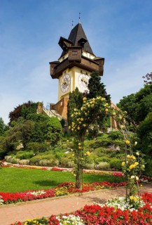 Rose garden on the Schlossberg with clock tower