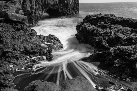 Water washes around stones