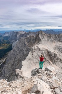 Woman standing on rocks and photographed
