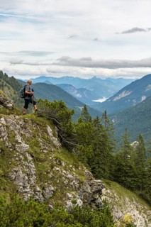 Hiker looks at the Sylvenstein Dam