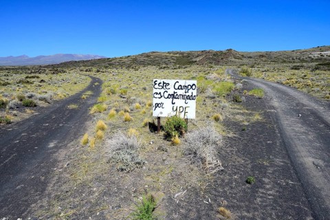 Runway with protest sign against oil company YPF