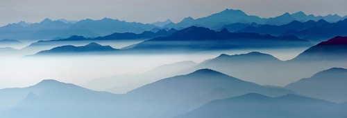 Blue graded mountain ranges in backlight