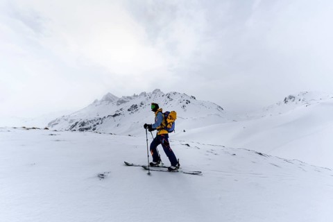 Ski tourers in the snow in fog