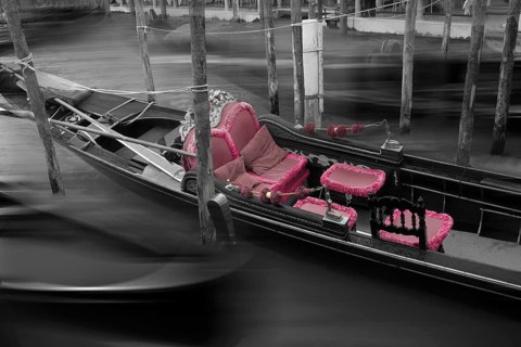 Gondola with fading red seat cushions