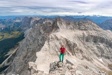 Woman standing on rocks and looking into the camera