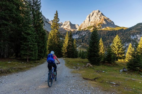 Mountain biker on gravel road to Seebensee