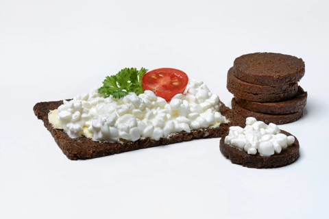 Pumpernickel slices topped with cream cheese