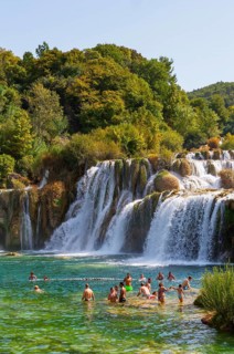 Tourists bathing at the Skradinski Buk waterfall