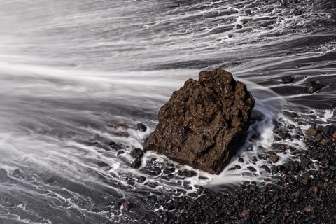 Water washes around stones