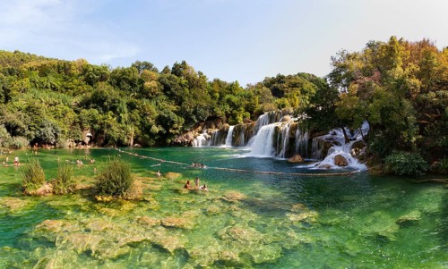 Tourists bathing at the Skradinski Buk waterfall