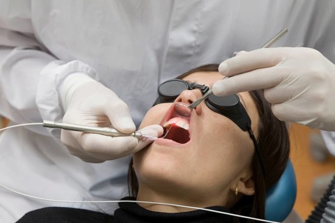 Dental treatment with laser