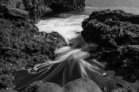 Water washes around stones