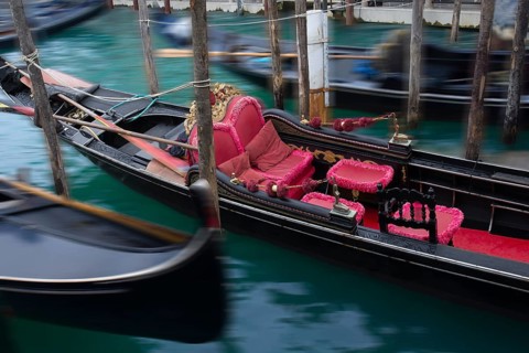 Gondola with red seat cushions