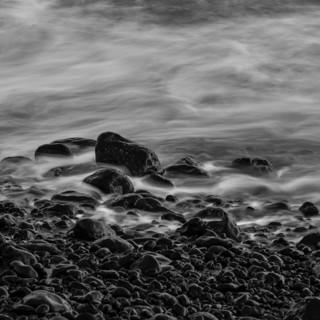 Water washes around stones