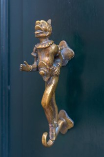 Antique bronze figure as door knocker