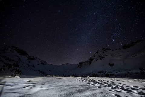 Starry sky with milky way in the mountains in winter