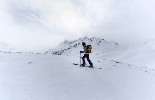 Ski tourers in the snow in fog