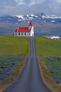 Road leads to the church of Ingjaldsholl behind the Snaefellsnessjoekull