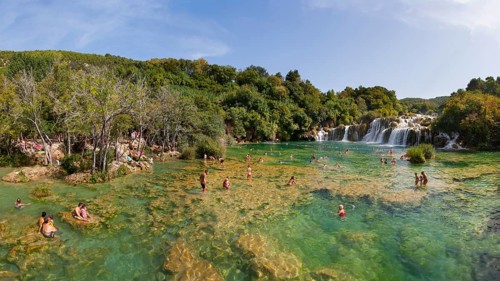 Tourists bathing at the Skradinski Buk waterfall