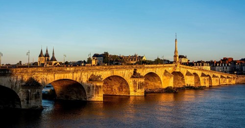 View on bridge Jacques Gabriel and the town of Blois at sunset