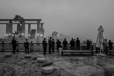 Chinese tourists on the dam of the power plant at the Three Gorges Reservoir