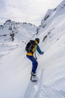 Ski tourers with splitboard on the downhill run