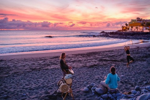 Drummers on the beach of La Playa at dusk