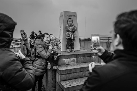 Chinese tourists on the dam of the power plant at the Three Gorges Reservoir