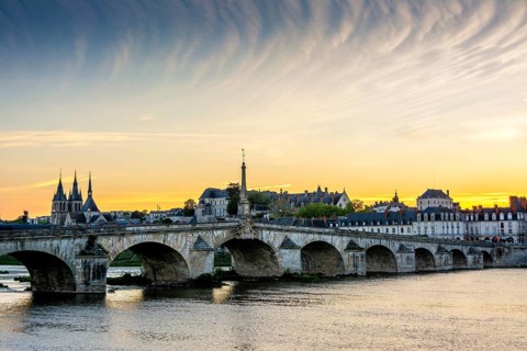View on bridge Jacques Gabriel and the town of Blois at sunset