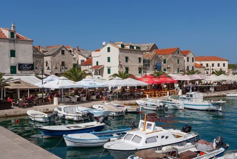 Promenade with fishing boats in the port