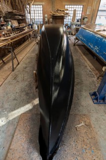 Freshly lined hull of a gondola in a boatyard on the island of Guidecca
