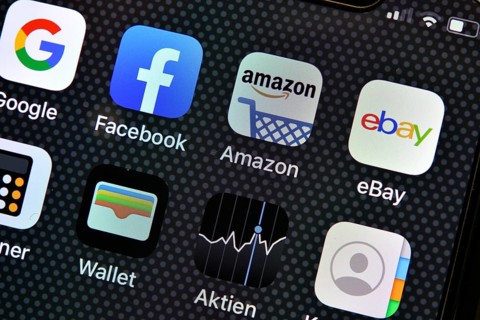 Various software apps on display of an Apple iPhone