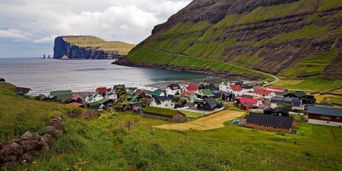 The small village of Tjornuvik with view of the Atlantic Ocean