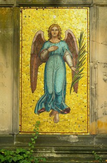 Angel with palm branch and star on gold