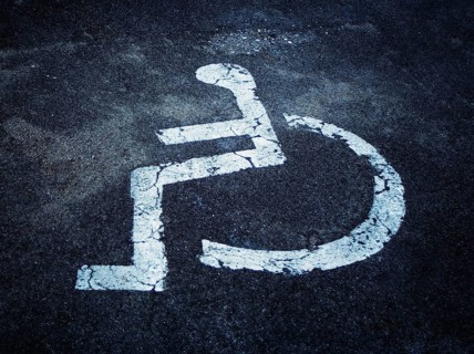 Pictogram of a disabled parking place on asphalt