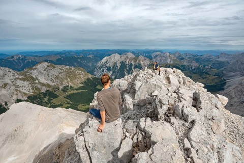 Hikers sitting on the summit of the Birkkarspitze