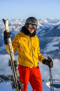 Skier in front of mountain panorama