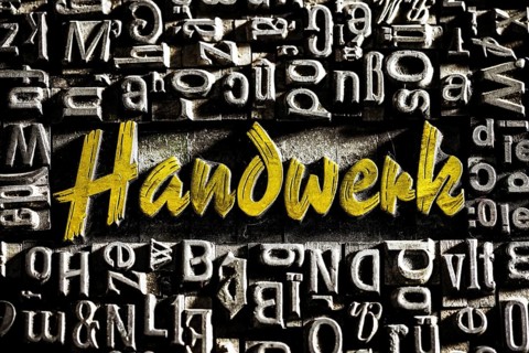 Old lead letters with golden writing show the word craft